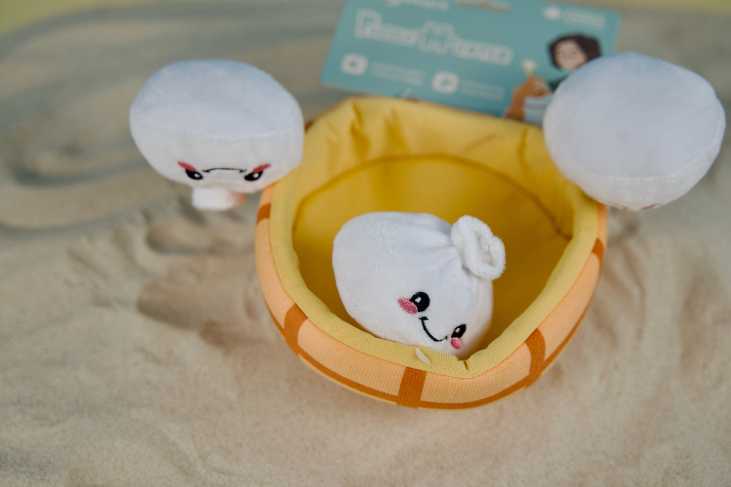 Asian-inspired dog toy set with steamer basket base and squeaky soup dumpling toys for interactive play