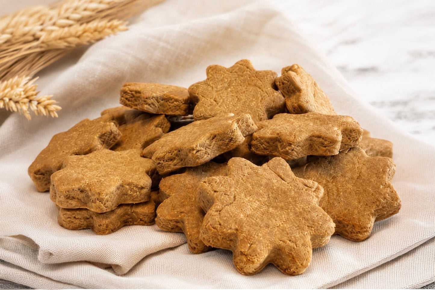 Close-up of Banana Bursts handcrafted dog treats, gluten-free banana biscuits made with wholesome ingredients.