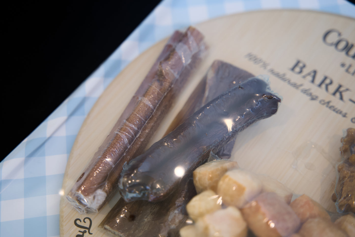 Dog treats on a plate with visible brand name.