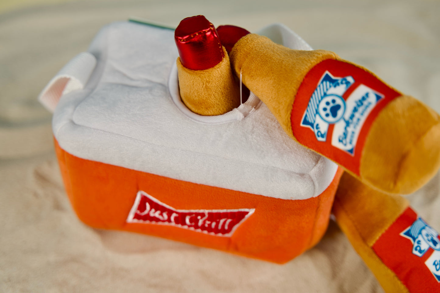 Interactive dog toy set with handle and removable beer-themed squeakers.