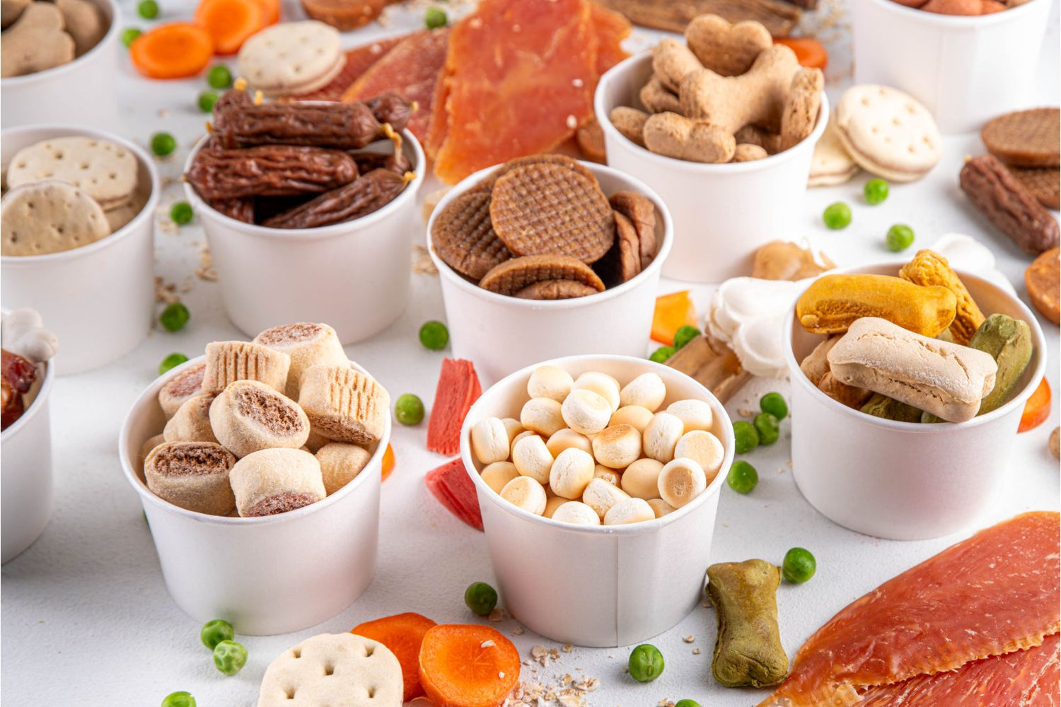 Natural dog treats in various small dishes.