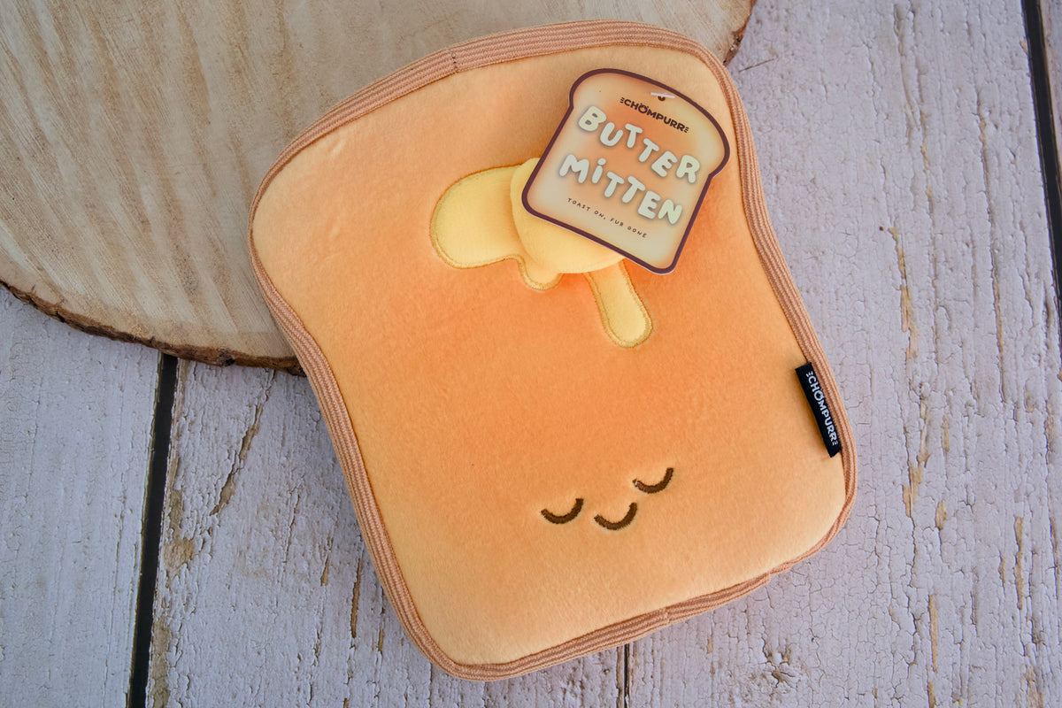 Chompurr Butter Mitten, a cute toast-shaped pet hair remover mitt for lifting loose fur from clothing, furniture, and carpets.