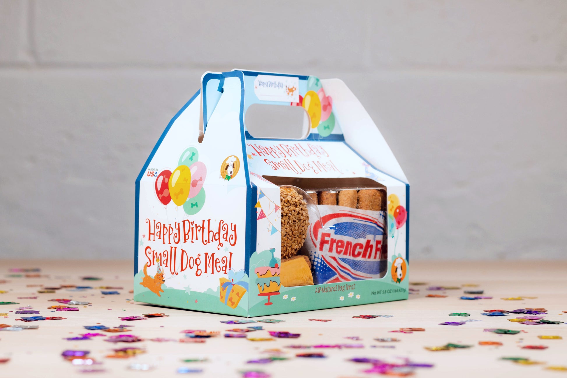 Dog treats resembling McDonald's Happy Meals for birthday parties.