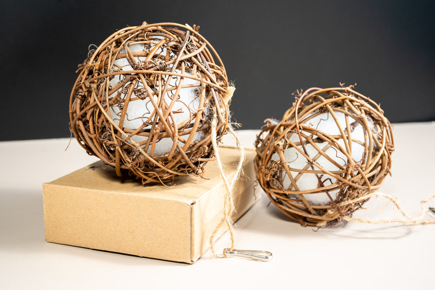 Pet bird toy, rattan ball with foam inside and hanging.