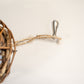Close-up view of the rope and hook for hanging the rattan bird ball.