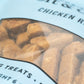 Close up view of dog treats in the shape of the letter B.