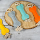 Felt bone dog toy with sturdy rope at the ends to encourage pulling.