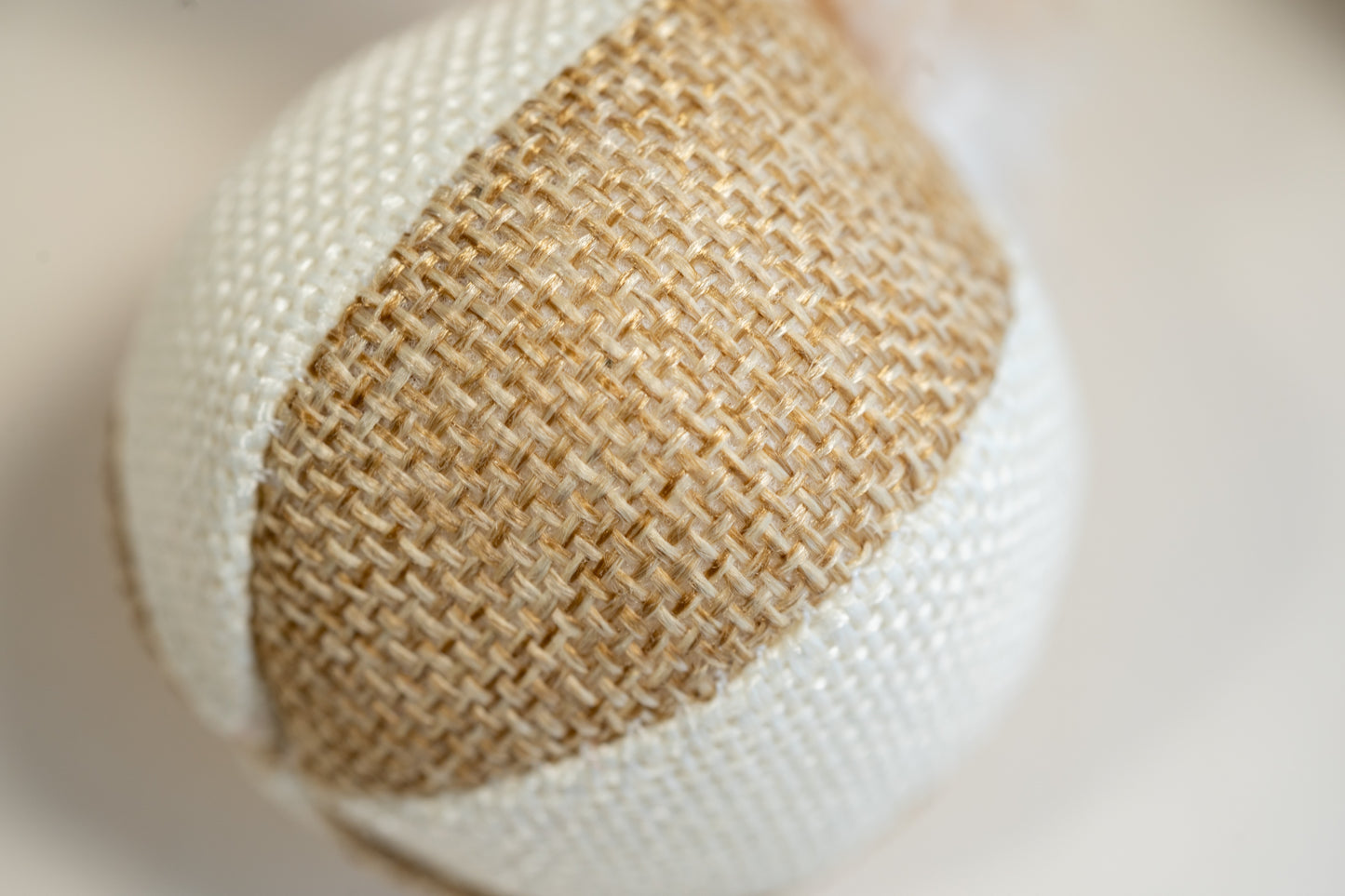 Small beach ball style cat ball made from burlap.