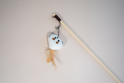 Close view of a cat teaser in head mouse shaped with a feather on the head.