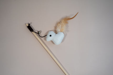 Close view of a cat teaser in bird shaped with a feather on the back.