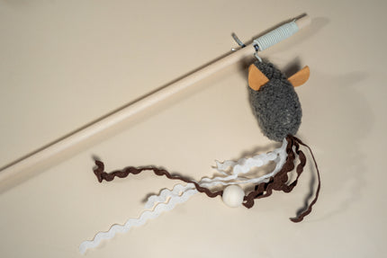 Cat teaser on stick with dark grey mouse.