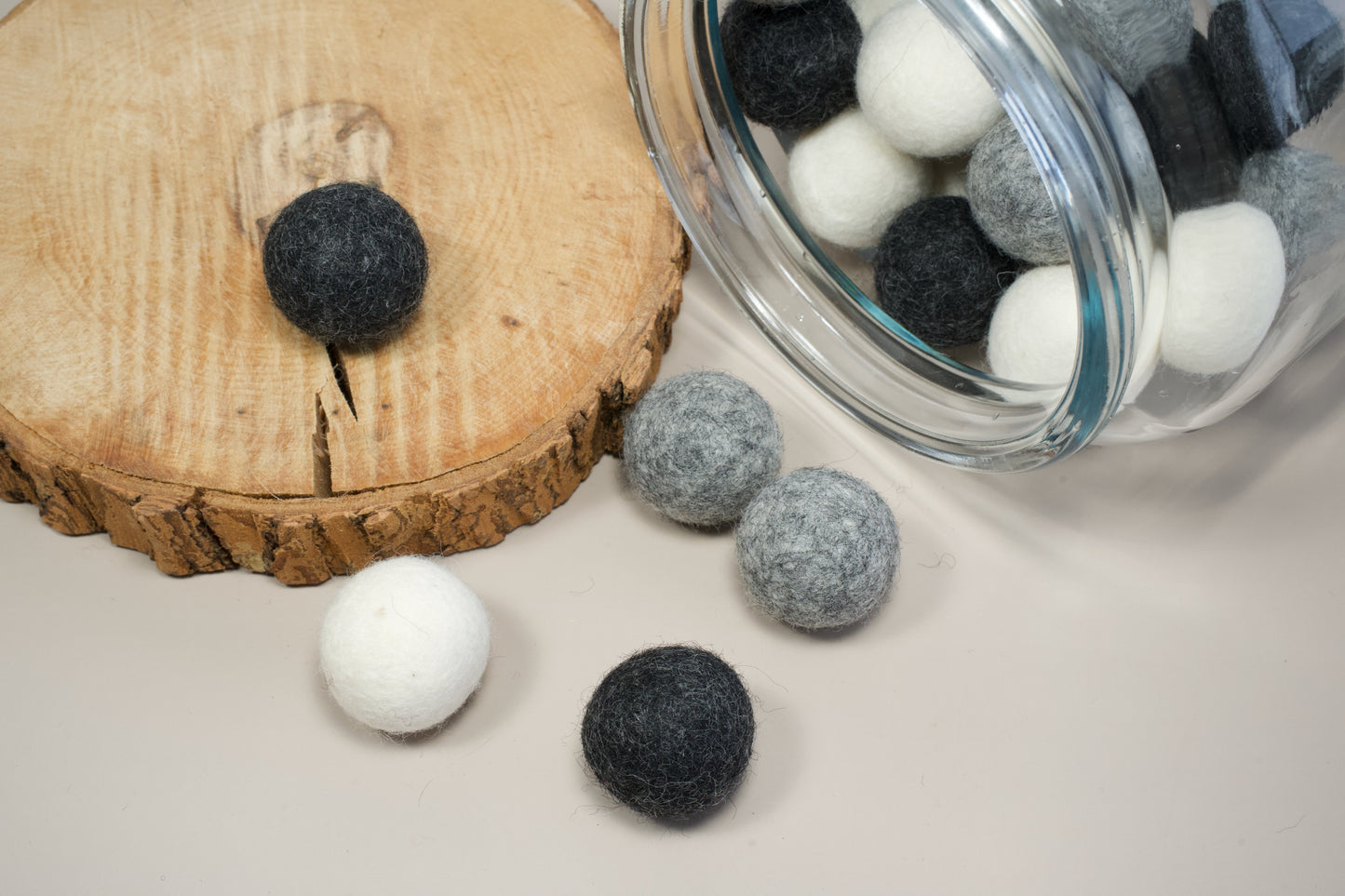 Wool balls of different colors for cats and small dogs.