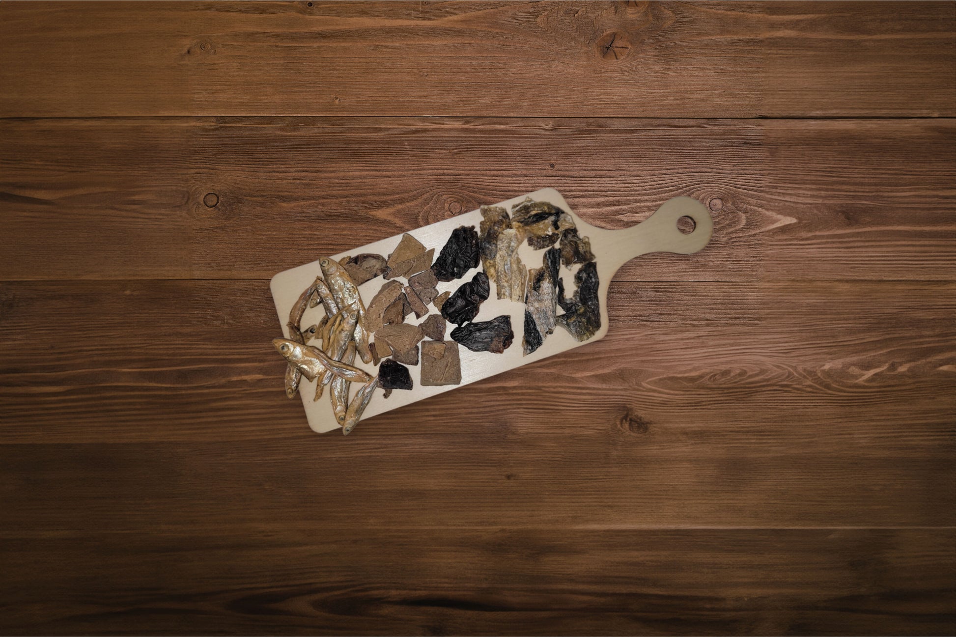 Charcuterie board for cats with freeze-dried treats.