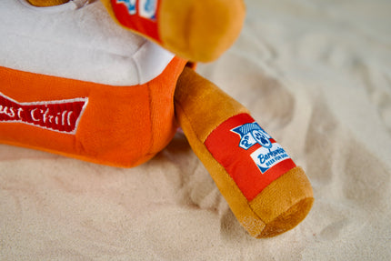 Close-up of three squeaky plush beer bottles inside a soft cooler.