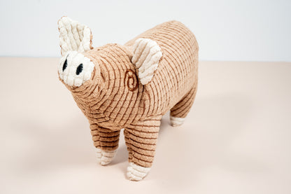 Brown pig shaped dog toy.