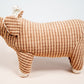 Side view brown pig shaped plush dog toy.