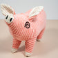 Pink pig shaped dog toy.