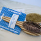 Dual sided bamdoo dog brush pet grooming tool.