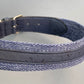 Navy blue dog collar with cork texture on a gray background.
