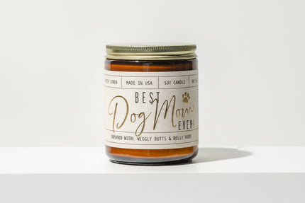 Candle jar with Best Dog Mom Ever label on a white background.