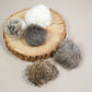 Handmade real rabbit fur cat pompoms in various colors, filled with natural wool.