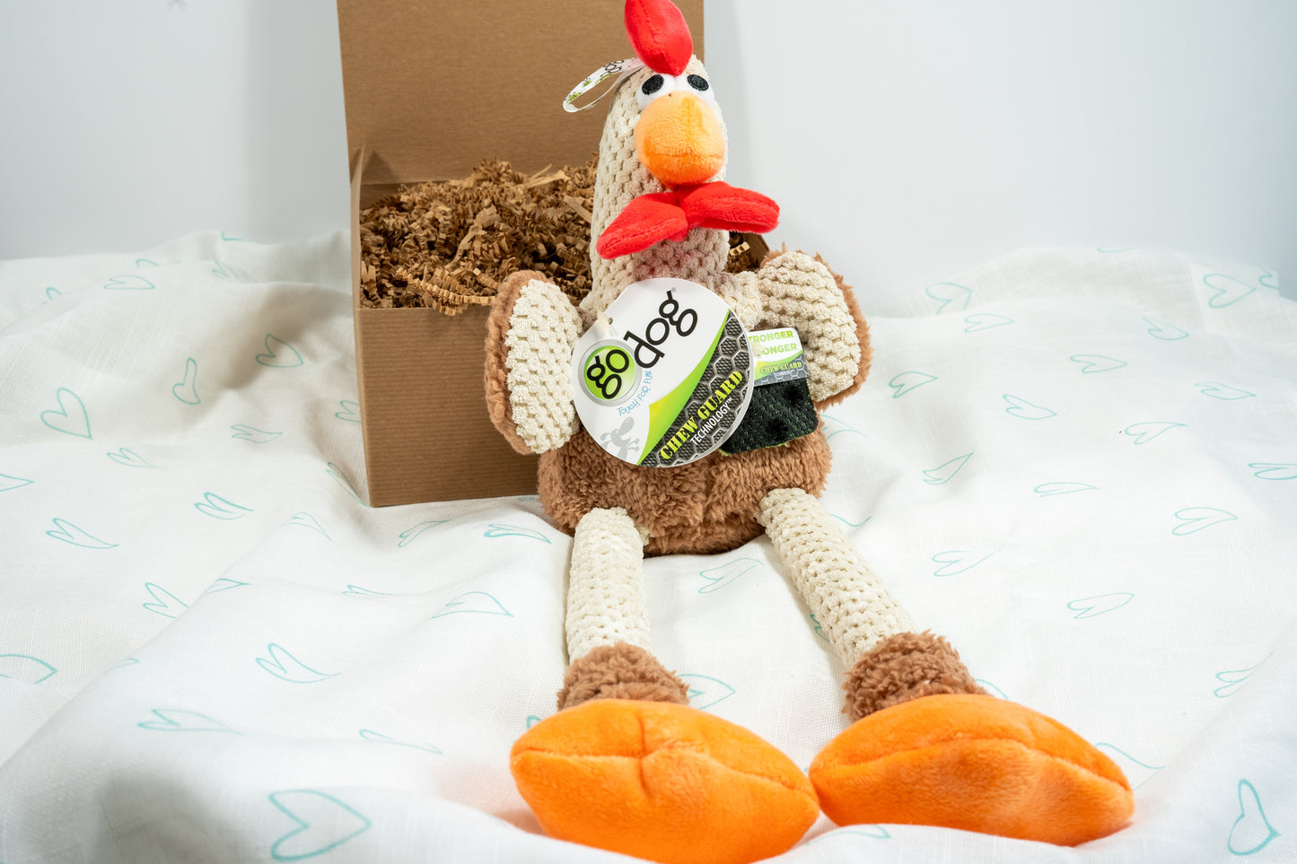 Large squeaker brown chicken plush dog toy constructed from a soft, textured, checkered plush.
