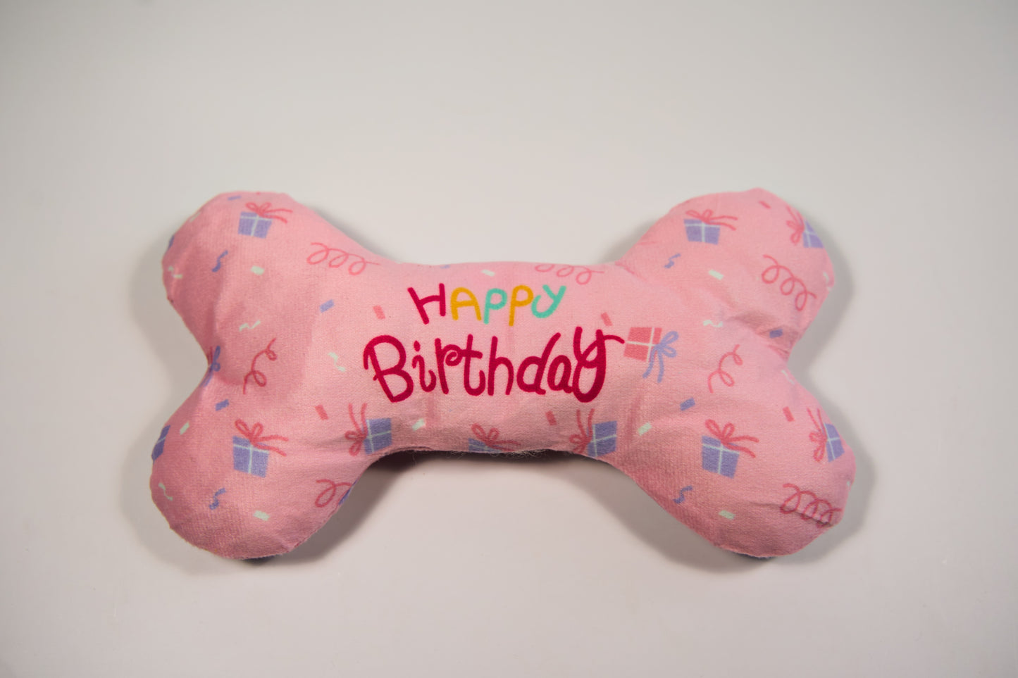 Happy birthday pink plush bone to celebrate your dog's birthday.