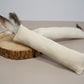 Natural cat kicker toy made with hemp fabric and natural feathers.