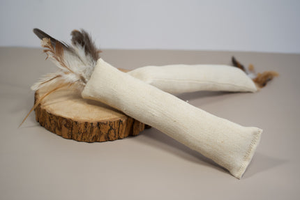 Natural cat kicker toy made with hemp fabric and natural feathers.