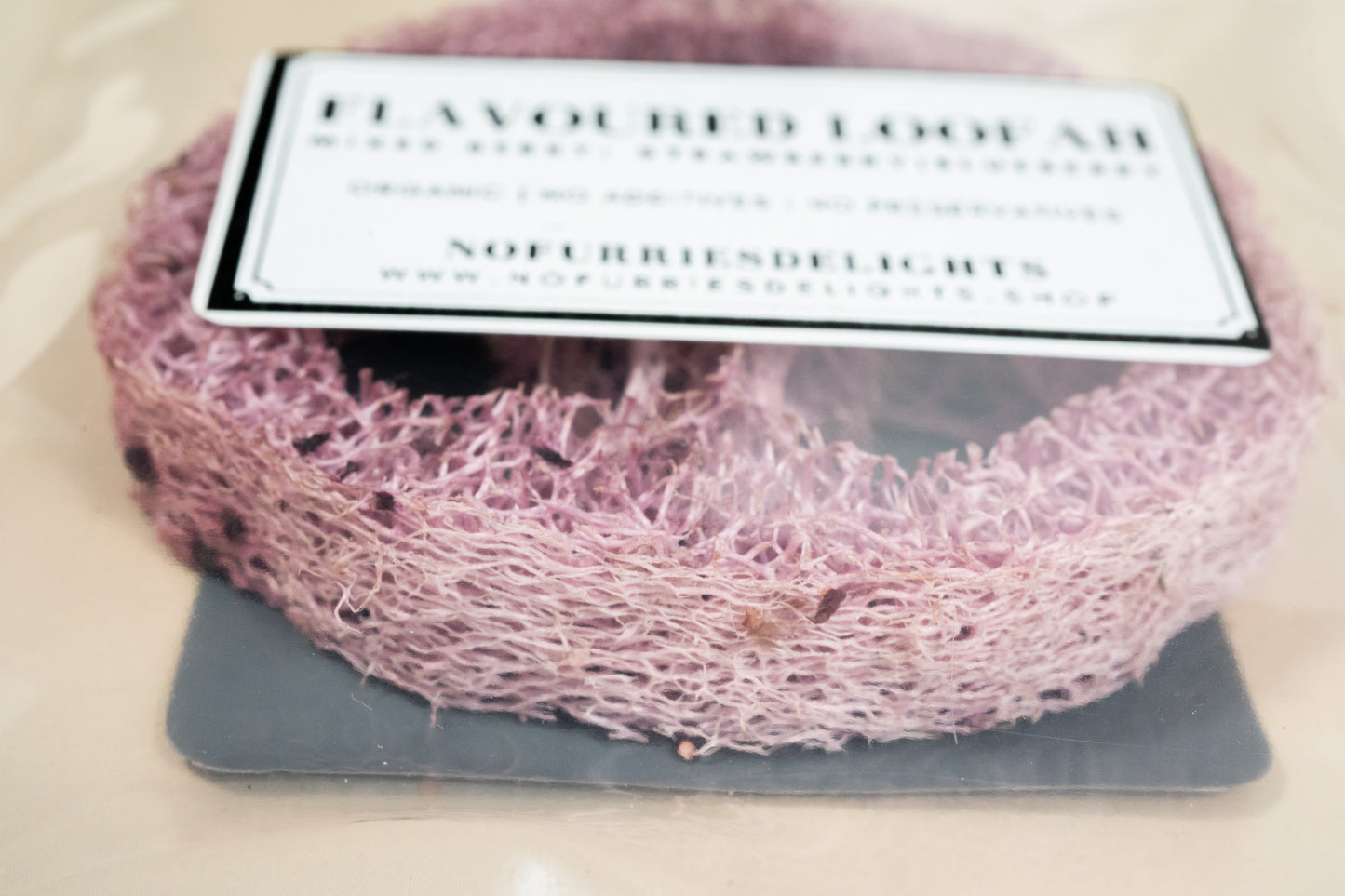 Close up image of the fibers of the mixed berry loofah.