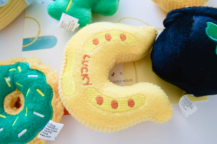 Horseshoe plush dog toy.