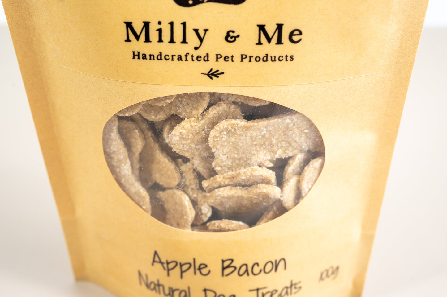 Close-up view of the apple bacon dog treats.