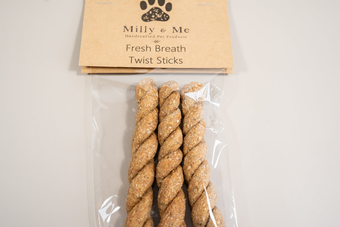 Close-up view of the 3 twisted stick fresh breath dog treats.
