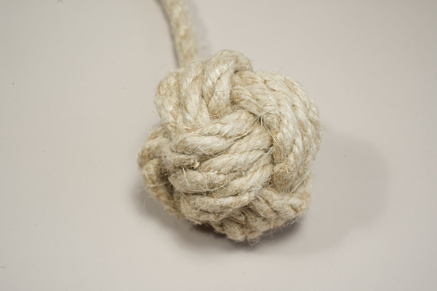 Close-up view of hemp fibers from the tip of the dog toy.