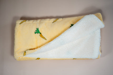 Vue intérieure de la couverture aux motifs de carottes.