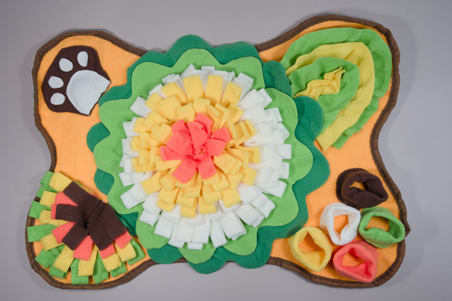 Bone-shaped dog sniffing mat with flowers and a sound effect under the paw design.