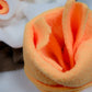 Enlarged view of an orange flower of the feeding mat.