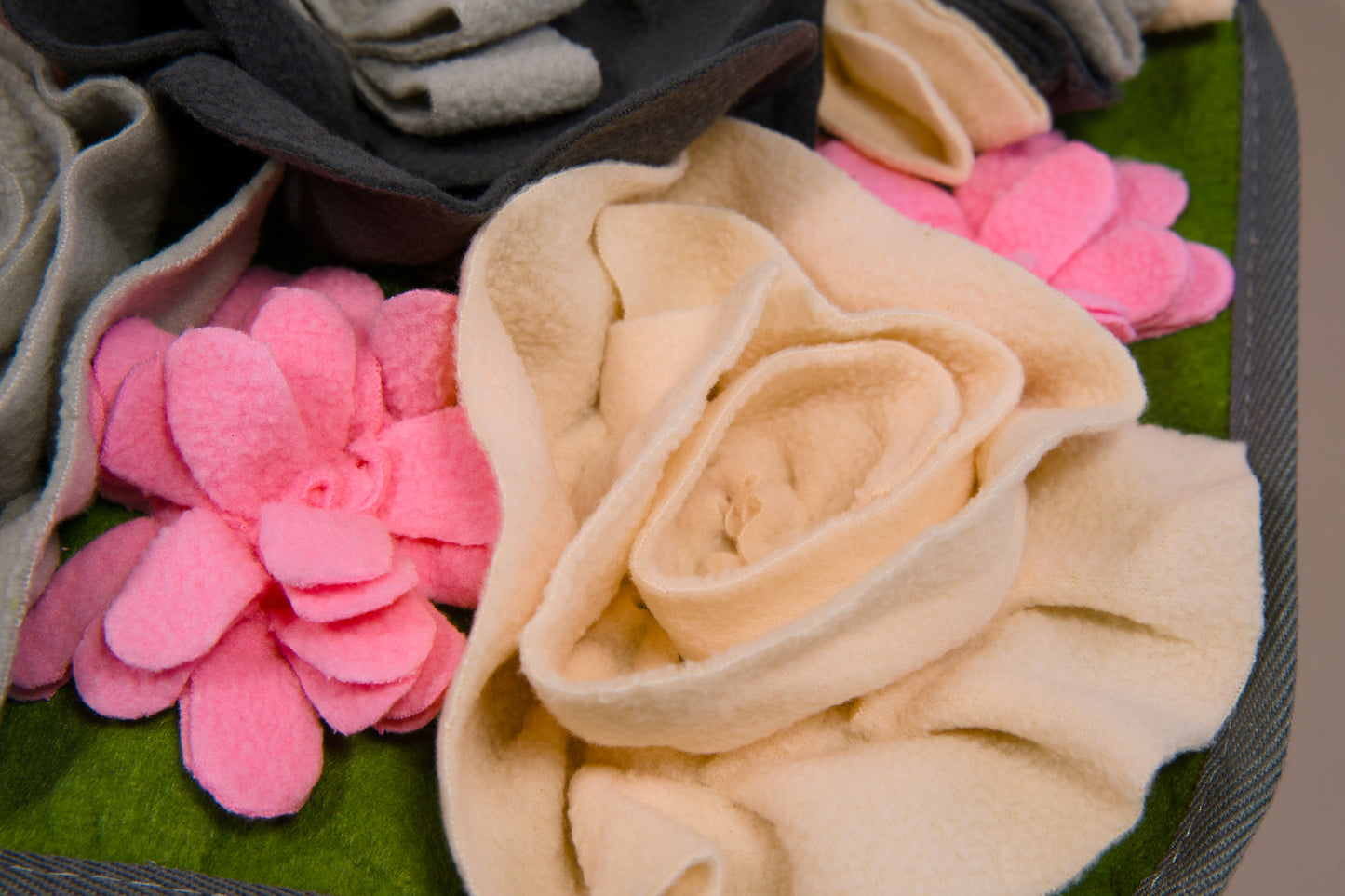 Enlarged view of a white rose of the pet feeder mat.