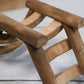 Close-up view of rustic wooden animal ladder.