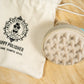 Eco silicone canine shampoo brush with a burlap bag.