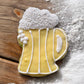 Decorative dog cookie shaped like a beer mug.